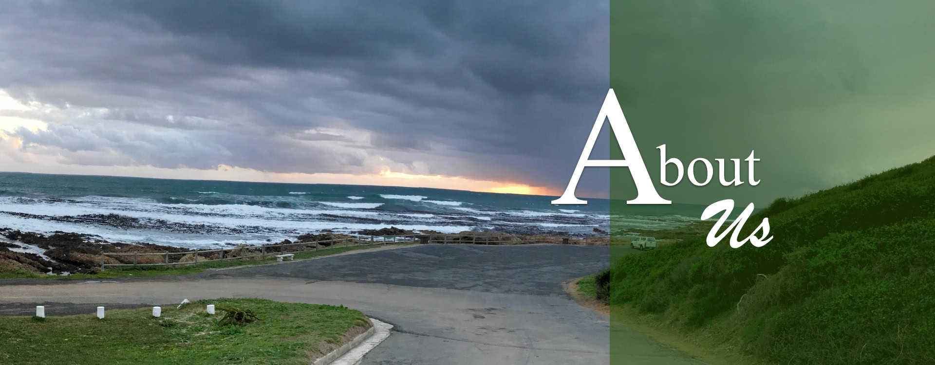Coastal landscape with About Us text overlay. Ocean waves, cloudy sky, and green hillside. Nature background.